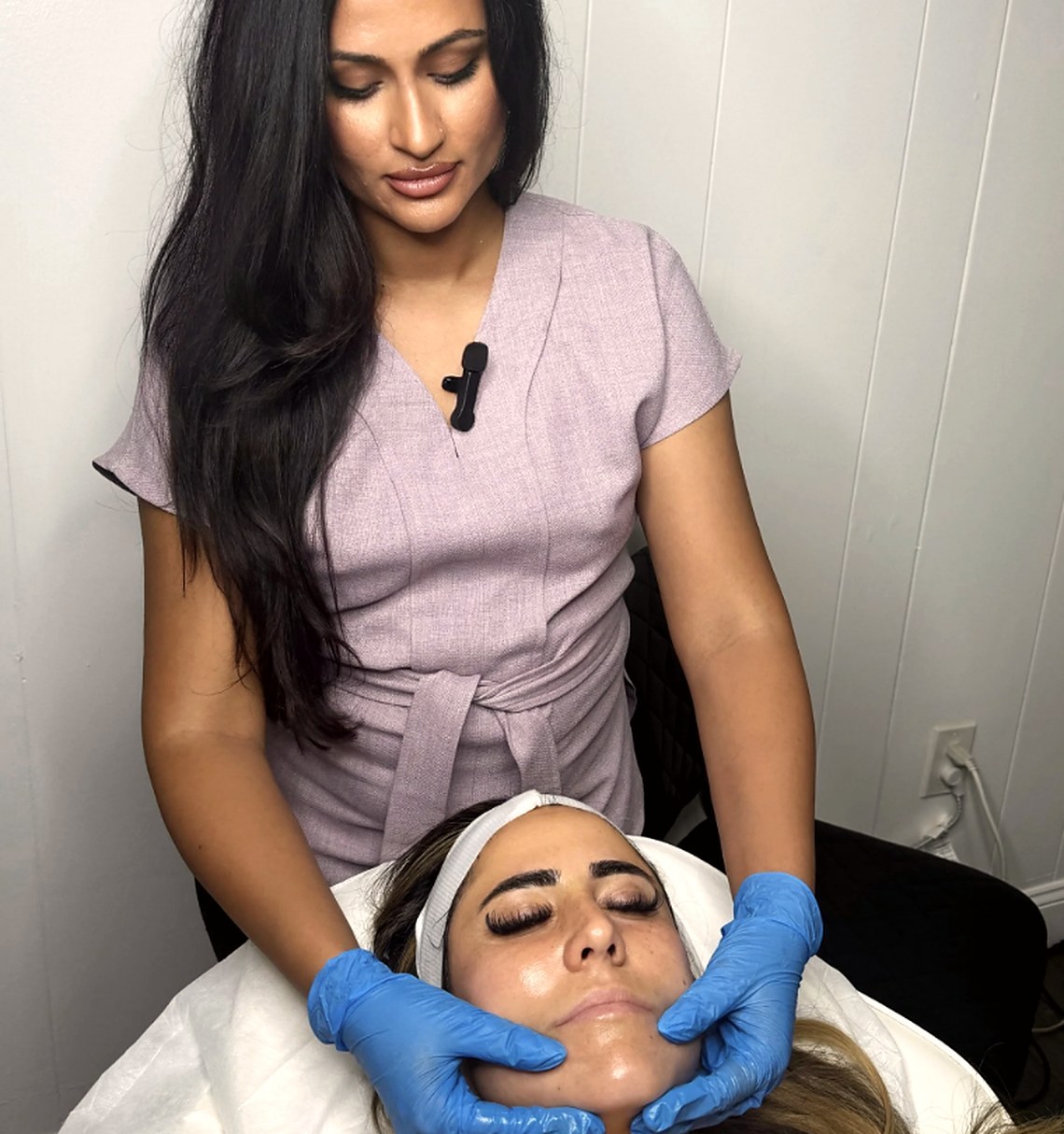 Marilena, owner and lead esthetician, performing a facial at Glow Up Suite
